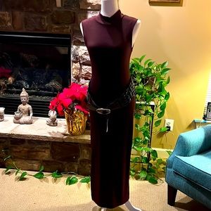 Long knitted sleeveless sweater dress.